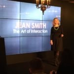 Flirtologist Jean Smith speaking at a company conference